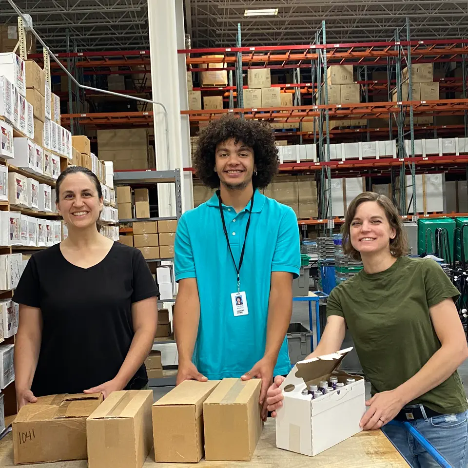 Three employees working in one of Lands’ End’s warehouses.